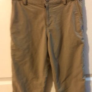Youth large Under Armour tan golf pants with adjustable waist. Great condition
